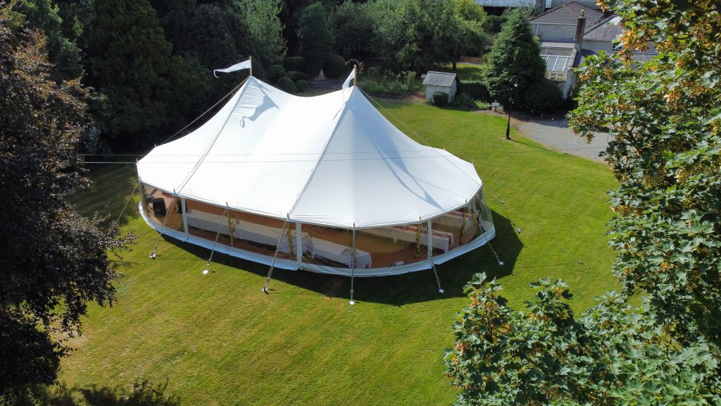 Aerial shot of a Traditional Pole Marquee in a rustic setting.