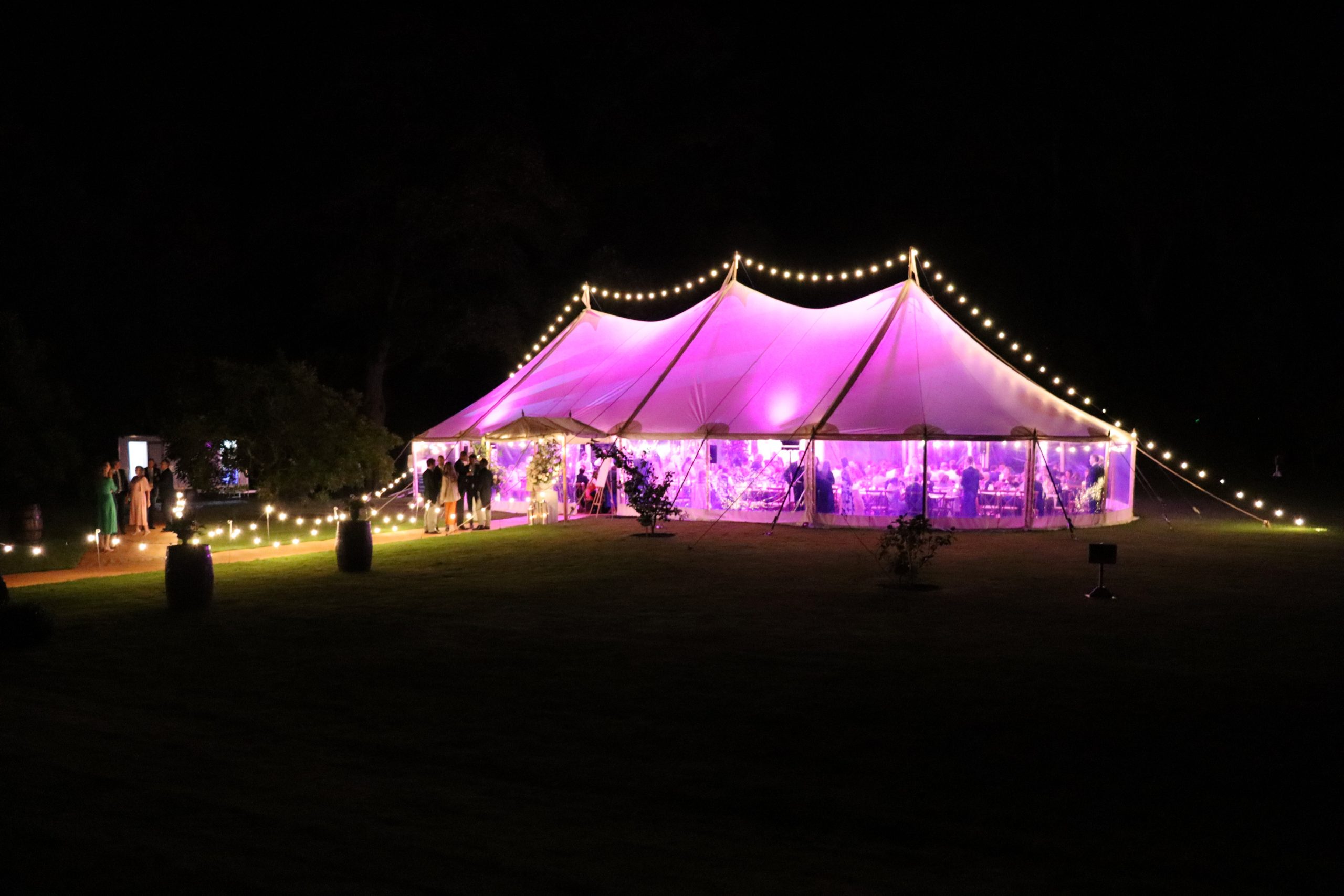 Traditional pole marquee illuminated by purple lighting