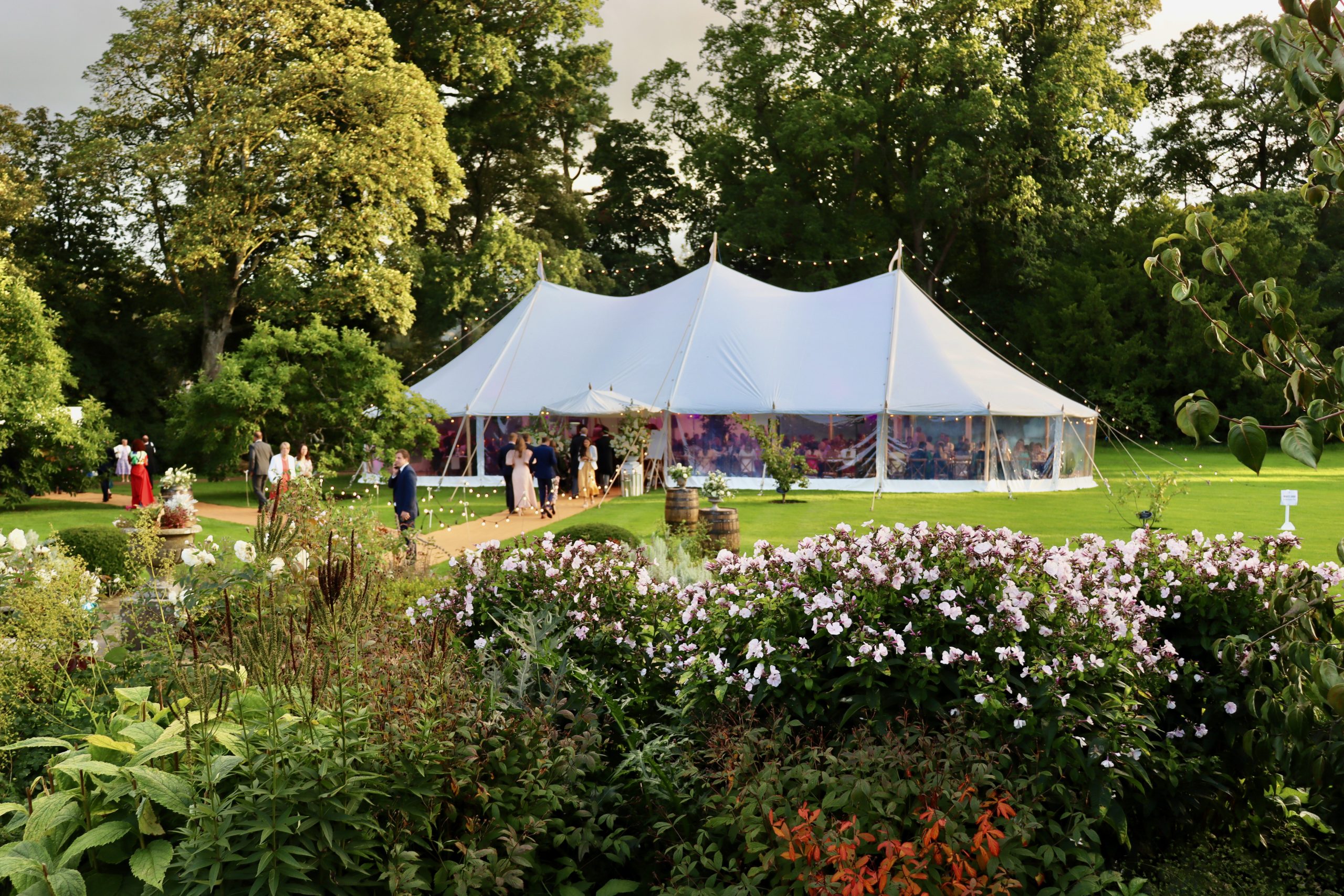 Traditional pole marquee wedding in a beautiful garden space