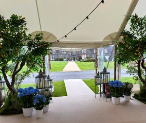 Entrance canopy decorated with lemon trees and metal lanterns